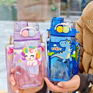 Close-up of cute unicorn and dinosaur square plastic water bottles with carrying straps