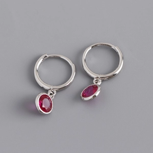 Detail view of S925 sterling silver hoop earrings with oval fuchsia zircon pendants