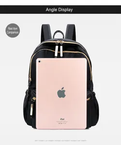 Detail showing black oxford cloth backpack size compared to a 10-inch tablet