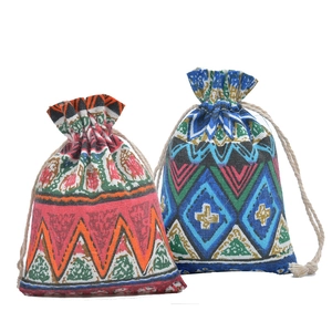 Ethnic style cotton drawstring gift bags with geometric patterns in red and blue