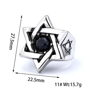 Macro shot of vintage men's steel ring with hexagram design and black gemstone center