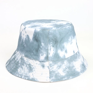 Close-up of blue and white tie-dye bucket hat showing reinforced stitching and canvas texture