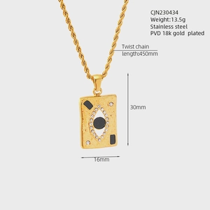 Macro shot of 18K gold plated stainless steel Evil Eye pendant with size measurements