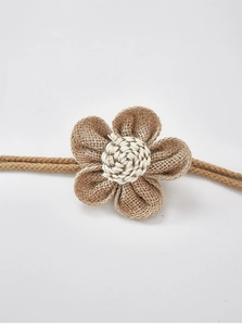 Detailed macro shot of handmade jute flower decoration with natural linen texture