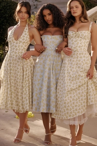 Detailed view of floral midi dresses with spaghetti straps and lace hemline details