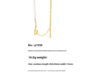 Detailed view of baroque pearl and gold stainless steel chain necklace with lava texture