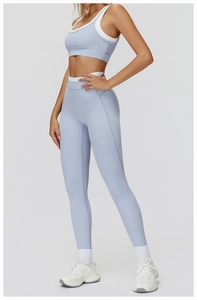 Detail view of light blue ribbed yoga set featuring double-layer neck and high-waist fit