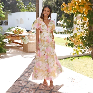 Elegant floral maxi dress with backless cutouts and puff sleeves for summer holidays