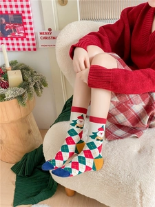Cozy Christmas socks with festive patterns shown in a warm indoor home lifestyle scene