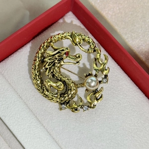 Chinese dragon brooch with gold finish, pearl accent and red crystal eyes on red box