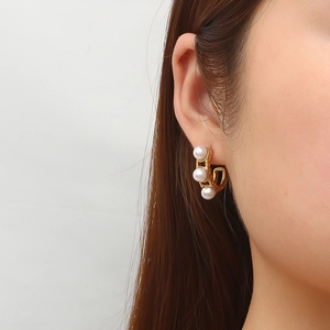 French vintage 18K gold plated stainless steel pearl hoop earrings on female model