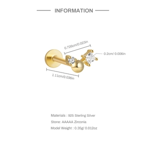 Macro shot of S925 sterling silver ear stud with golden finish and AAAAA cubic zirconia
