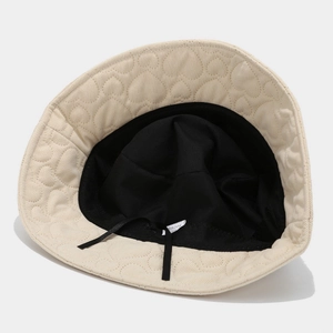 Beige quilted corduroy bucket hat with heart pattern and adjustable inner drawstring
