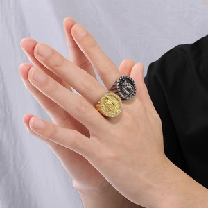 Detail of vintage Egyptian Pharaoh and Anubis rings with diamonds on model's hand