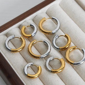 Polished gold and silver two-tone hoop earrings in small, medium, and large sizes