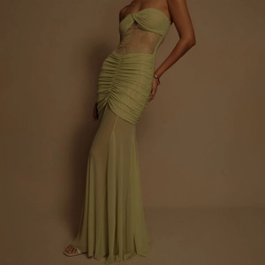 Close-up of olive green mesh dress featuring sheer lace panels and ruched detailing