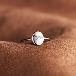 Macro detail of S925 sterling silver ring featuring a pinky swear promise engraving