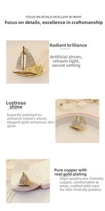 Close-up of gold sailboat brooch featuring copper plating and cubic zirconia inlay