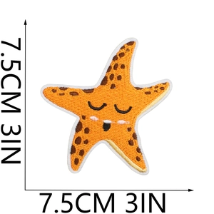 Close-up of orange starfish embroidery patch with brown spots and 7.5cm size markings