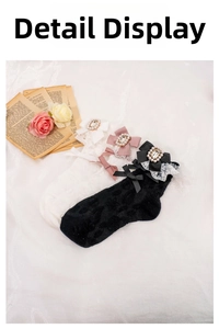 Macro shot of Lolita socks with lace trim, silk bows, and sparkling square rhinestones