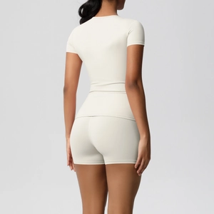 Detail of high-elastic back-view yoga set showing seamless shaping and cream white fabric