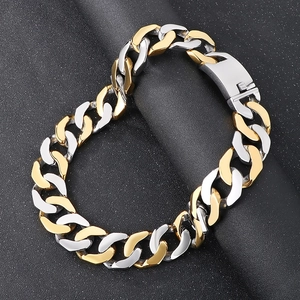 Detailed view of bicolor silver and gold 30mm Cuban link bracelet in polished steel