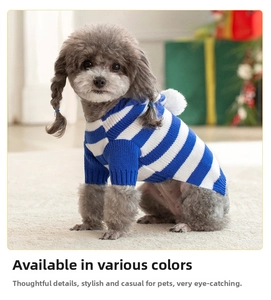 Detail of blue and white striped knit dog sweater with a decorative plush pompom on the back