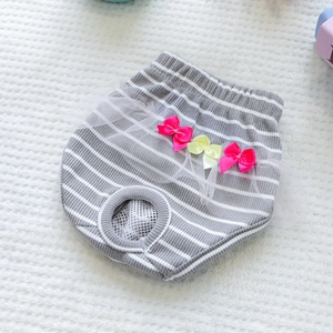 Detail of grey striped dog sanitary pants with pink bow and breathable mesh lining