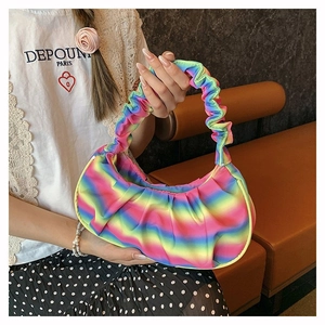 Detail view of the colorful rainbow striped shoulder bag with a stylish scrunchie handle