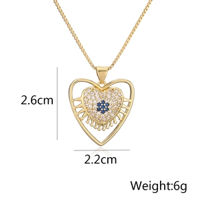 Detailed view of 18K gold heart pendant with zircon floral inlay, 2.6cm x 2.2cm size