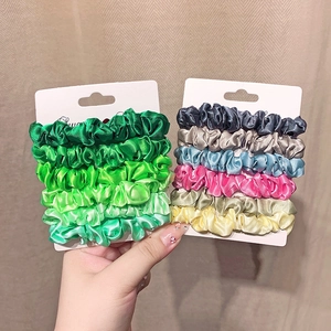 Set of 6 high-elasticity satin scrunchies in green and mixed colors on display cards