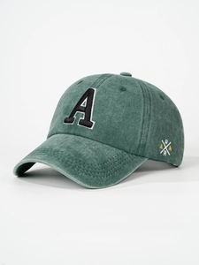 Close-up of deep green washed cotton baseball cap with letter A towel embroidery