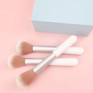 Three professional soft fiber blush brushes with white handles and silver ferrule finish