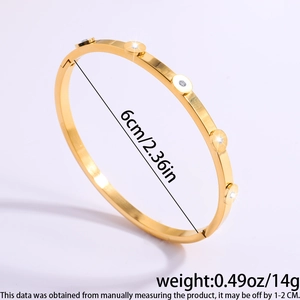 Detail of gold petal bangle showing 6cm diameter and 14g weight measurements