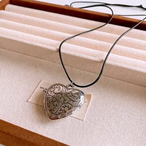Vintage heart pendant necklace with wax cord and intricate floral engraving for women