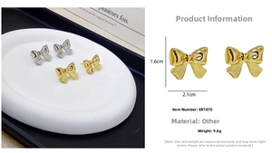 Detailed view of bow stud earrings with dimensions 2.1x1.6cm and polished finish