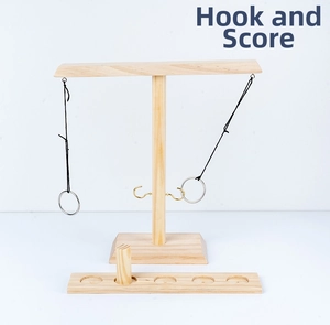 Detail of wooden hook and ring toss game with scoring base and hanging metal rings