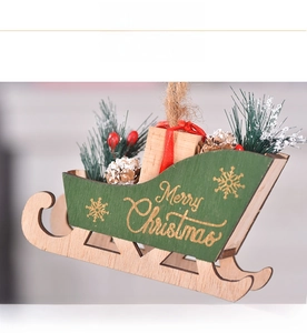 Detail of wooden Christmas sleigh ornament with Merry Christmas text and pine cones