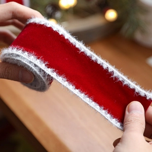 Red velvet Christmas ribbon with white faux fur edges for holiday gift wrapping decoration