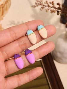 Detailed close-up of Van Gogh oil painting style oval earrings in morandi color tones