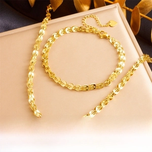 Detail of gold-plated phoenix tail chain set with lobster clasp and heart pendant