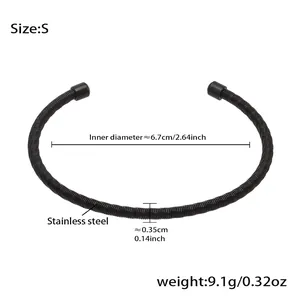 Minimalist black stainless steel open spring bracelet with smooth cylindrical end caps