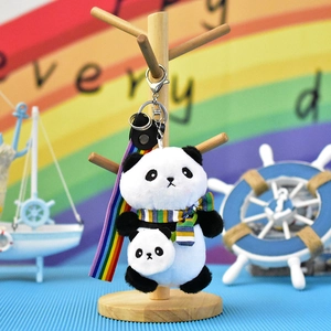 Cute panda plush keychain with striped scarf and colorful rainbow strap detail view