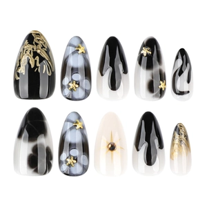Short almond press-on nails with black flower petals, gold branches and marble patterns