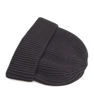Close-up of black ribbed knit beanie with thick texture and wide cuff design