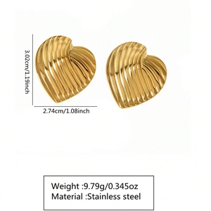 Detailed view of golden stainless steel heart earrings showing 3.02x2.74cm size and 9.79g weight