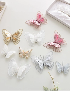 Detailed close-up of double-layer sequin butterfly clips in assorted pastel colors