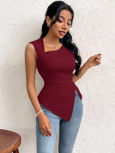 Detail of burgundy slim-fit sleeveless top with asymmetrical neckline and soft fabric texture