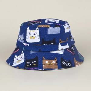 Detail of navy canvas sun hat with colorful cartoon cat print and durable fabric texture