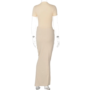 Detail view of the back of a beige maxi dress with short sleeves and waist side cutouts